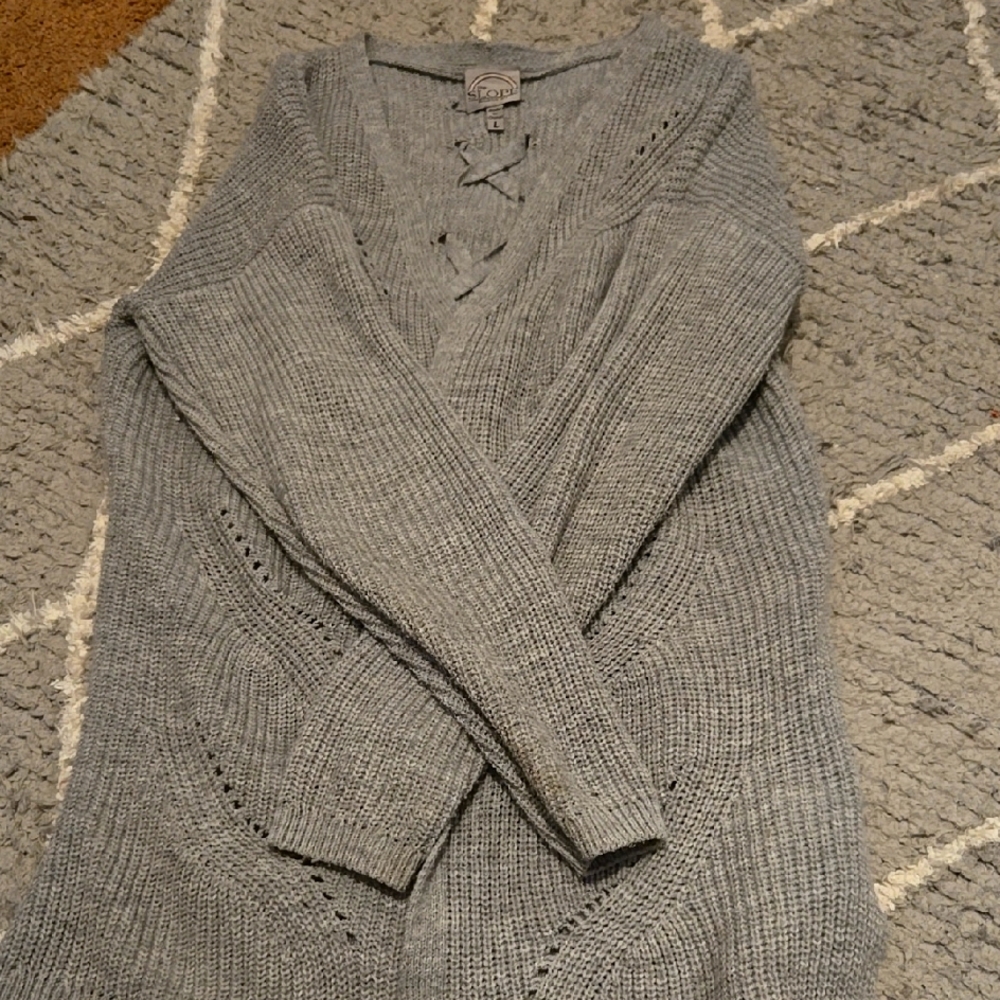 Womens opened up sweater with a cute back